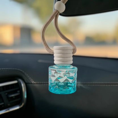 ME HHH Gold car perfume hanging in a car, adding an elegant fragrance to the interior.