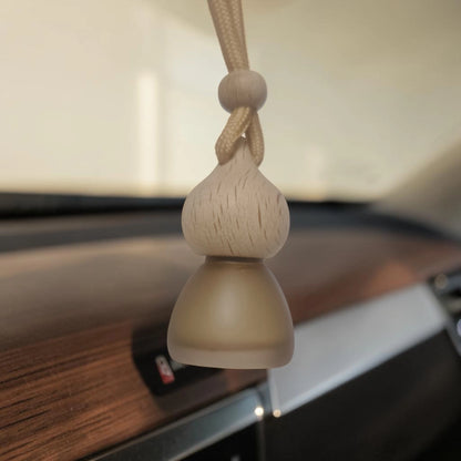 Best car perfume in India hanging air freshener in a car interior.