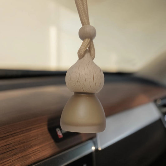 Best car perfume in India hanging air freshener in a car interior.
